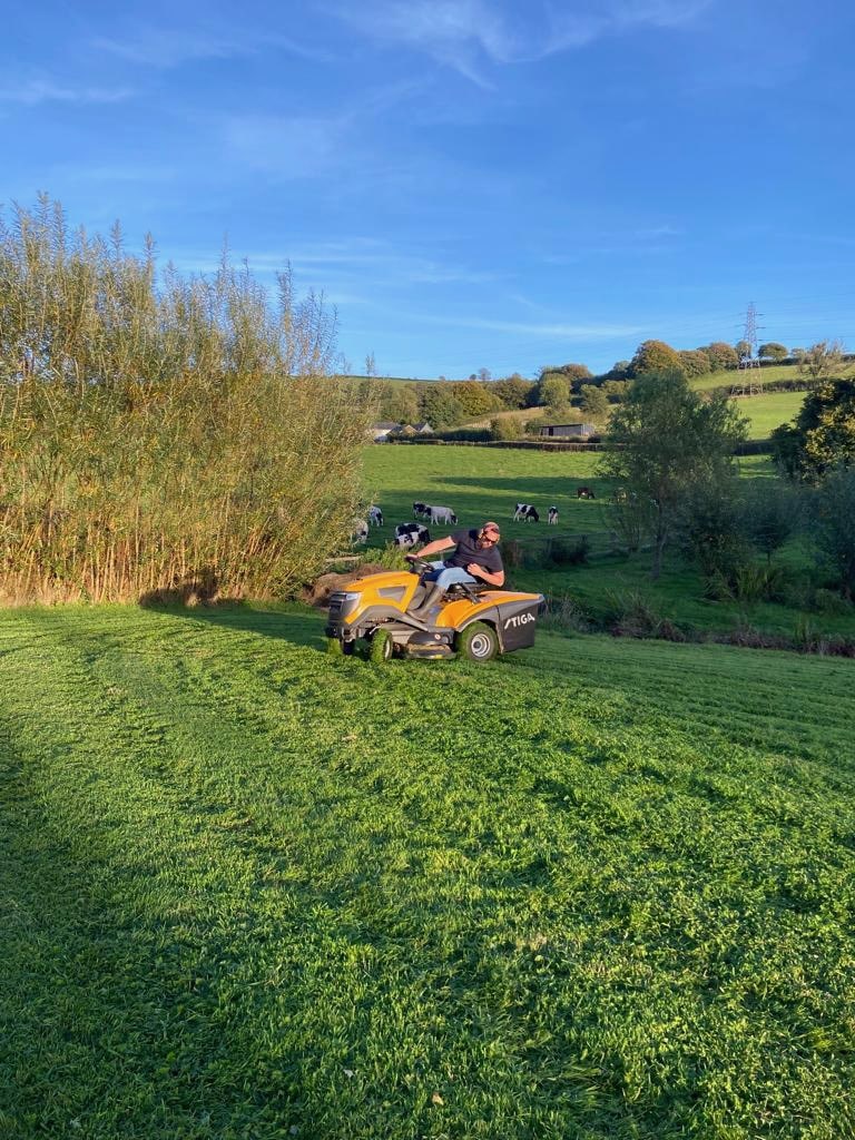 Mowing the lawn, Devon, UK